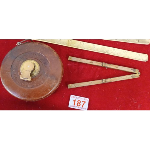 187 - Brass, wooden and tape measuring devices and more