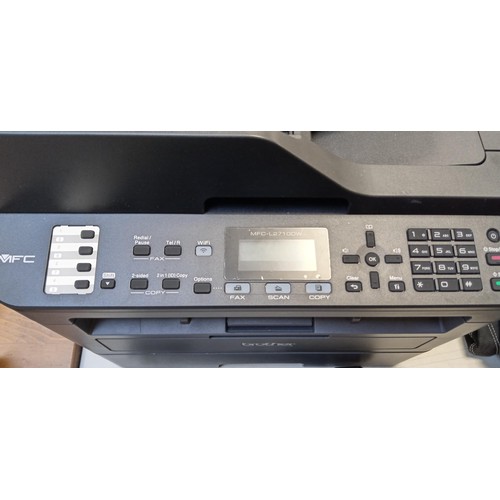 226 - Brother printer model MFC-L2710DW with a spare cartridge