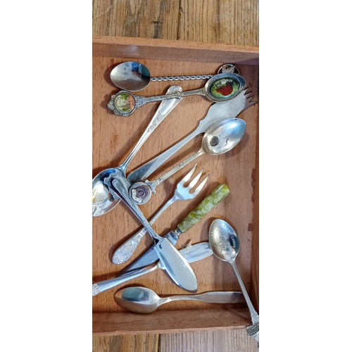 12 - Selection of vintage teaspoons and cutlery plus sugar tongs in a vintage cigar box