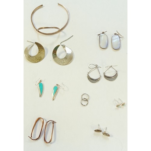 24 - 8 Pairs of silver earrings plus silver bangle