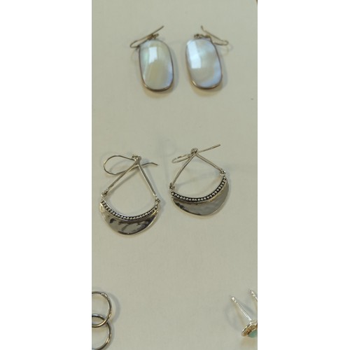 24 - 8 Pairs of silver earrings plus silver bangle