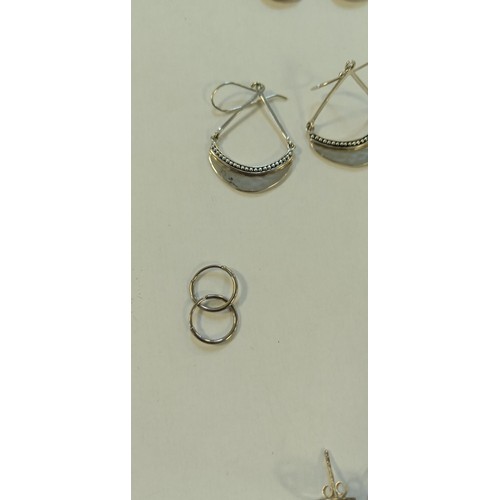 24 - 8 Pairs of silver earrings plus silver bangle