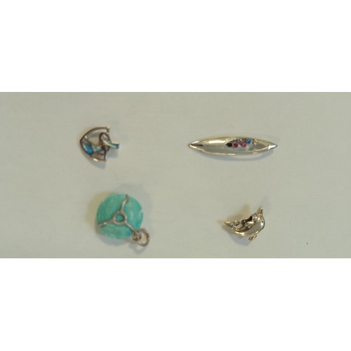 26 - 8 Silver pendants or brooches