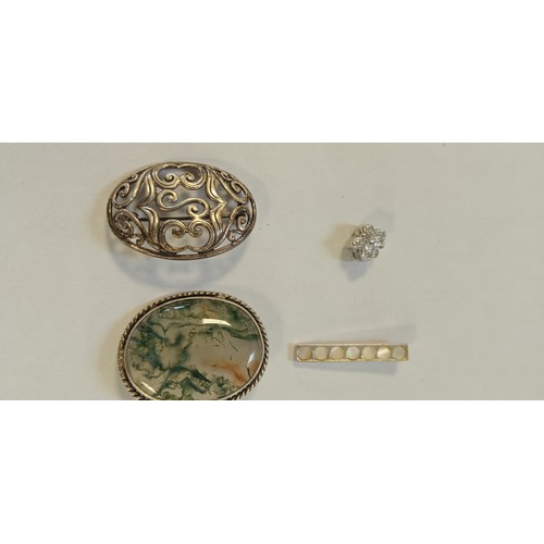 26 - 8 Silver pendants or brooches