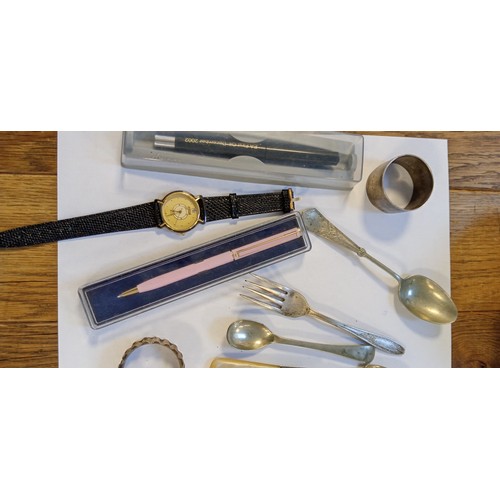 43 - Selection of odds from a deceased estate to include silver hallmarked napkin ring, pens, watch and m... 