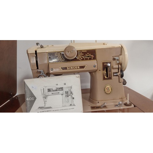 31 - Slant-o-matic Singer sewing machine in folding out table and stool