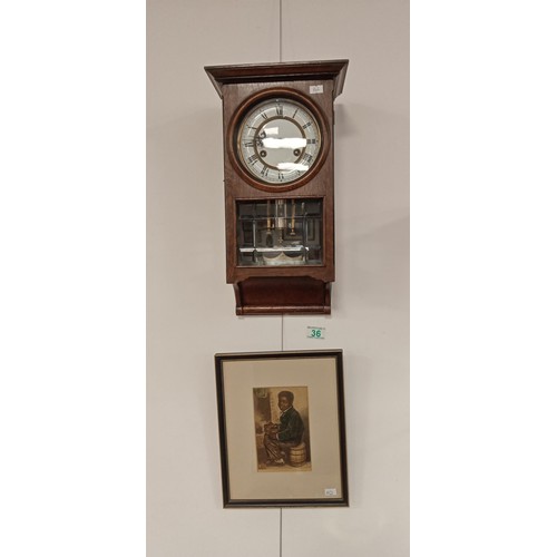 36 - Wall pendant cased clock plus framed vintage picture of child sitting on a barrel