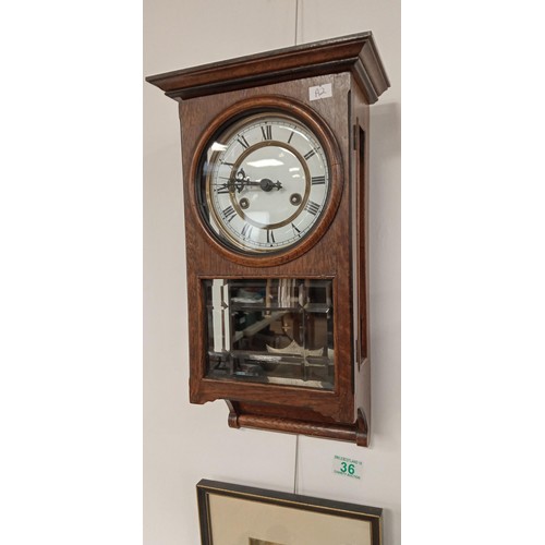 36 - Wall pendant cased clock plus framed vintage picture of child sitting on a barrel