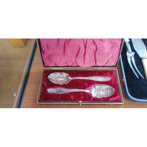 56 - Boxed carving set plus 2 boxed ornate spoons