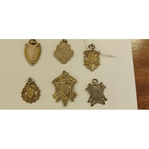 106 - 6 silver hallmarked fobs 1 inscribed and 1 enamelled