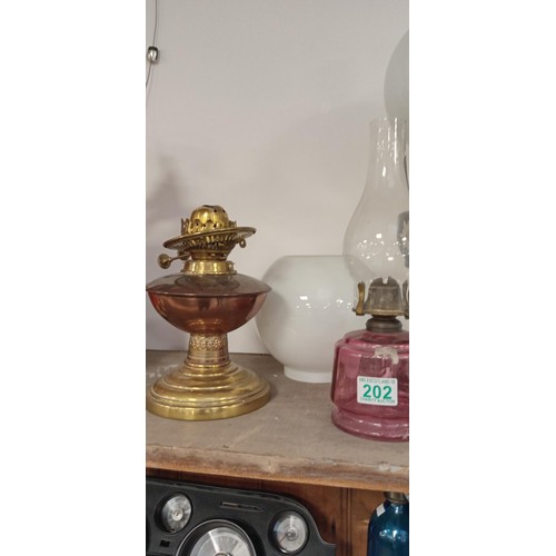 202 - Selection of vintage oil lamps