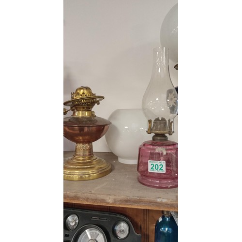 202 - Selection of vintage oil lamps