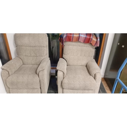 252 - Pair of rise and fall electric chairs in oatmeal colour fabric