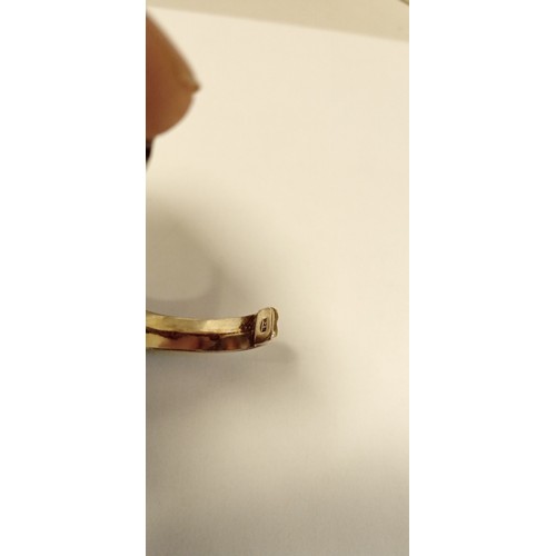 79 - 925 stamped decorative bangle with possible amber inlaid stone plus white metal ring