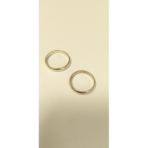 80 - Pair of silver wedding bands size x & T approx.