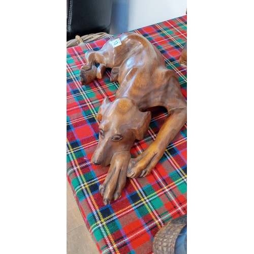 13 - Large wooden dog ornament 57cm long approx.