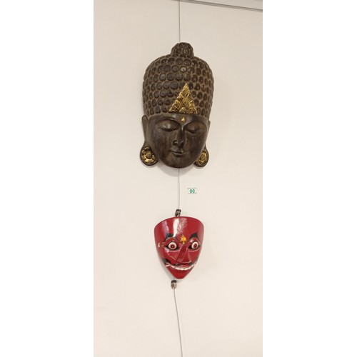 80 - Wooden Buddhist face mask plus one other