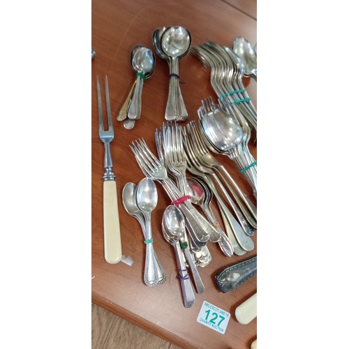 127 - Selection of vintage cutlery to include knives, forks, spoons and more