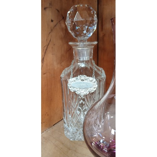 242 - 2 Crystal decanters plus one other