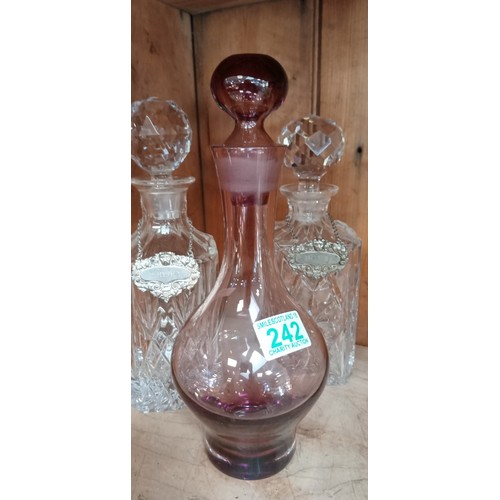 242 - 2 Crystal decanters plus one other