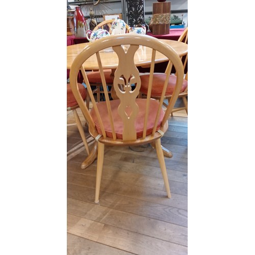 333 - Ercol round dining table with 4 chairs in light wood with gold button