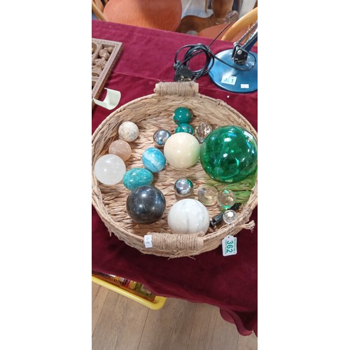 362 - Basket with ornate eggs, glass spheres and more