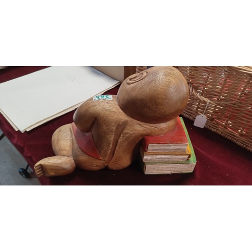 385 - Sleeping Buddha figure with books