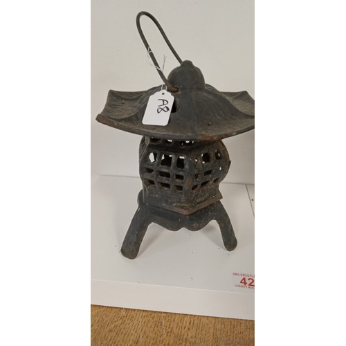 42 - Pair of cast iron Oriental style lanterns 30cm high approx.