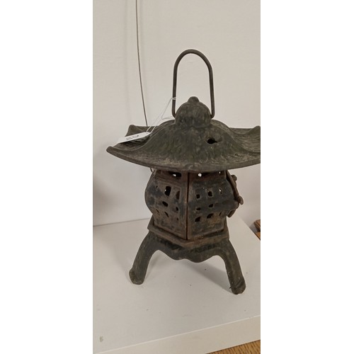 42 - Pair of cast iron Oriental style lanterns 30cm high approx.