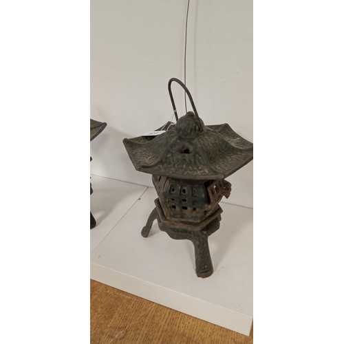 42 - Pair of cast iron Oriental style lanterns 30cm high approx.