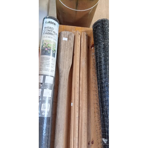 237 - Wooden rulers, pick handle, roll of weed control still sealed , mesh net