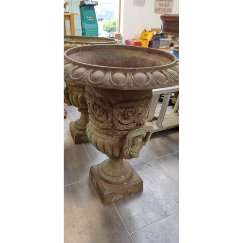 266 - Pair of cast garden urns standing 60cm high approx.