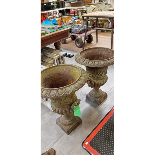 266 - Pair of cast garden urns standing 60cm high approx.