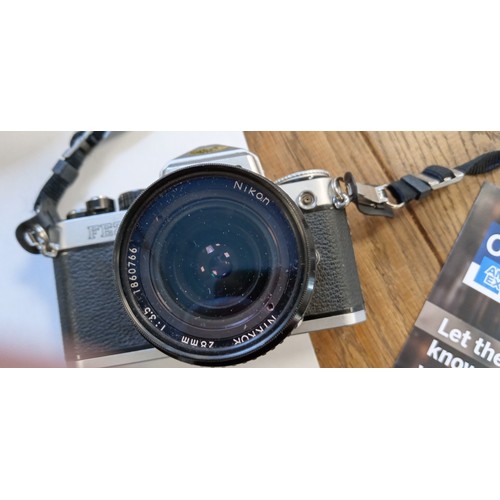 2 - Nikon FE2 35mm camera with Nikkor 28mm lens plus Praktica B100 electronic camera