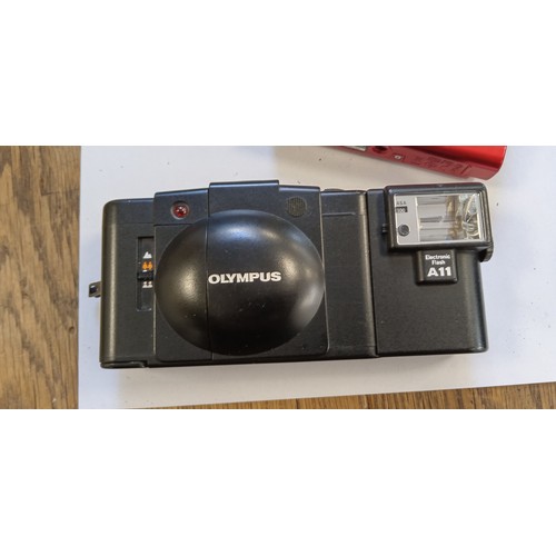 7 - Olympus XA 2 electronic flash camera made in Japan plus Olympus tough TG-310 14 megapixel camera