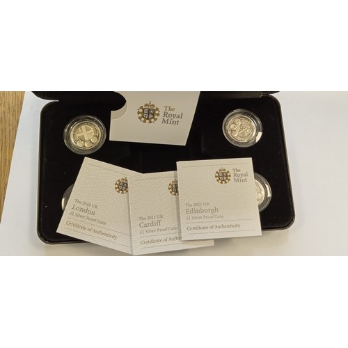 18 - Royal Mint 2011 UK Edinburgh £1 silver proof coin set with COAS (1 COA is missing)
