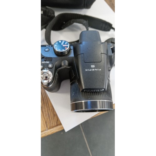 11 - Fujifilm finepix S camera with super EBC Fujinon lens 24x zoom f=4.3-103.2 1:3.1-5.9