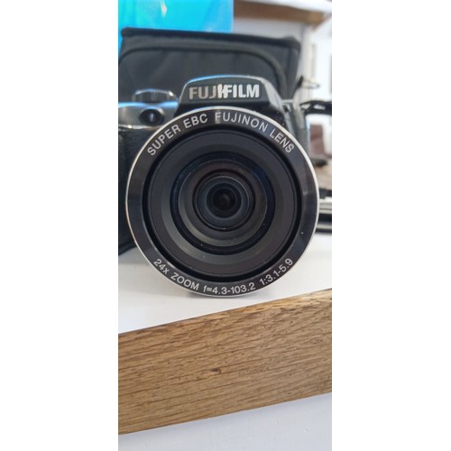 11 - Fujifilm finepix S camera with super EBC Fujinon lens 24x zoom f=4.3-103.2 1:3.1-5.9
