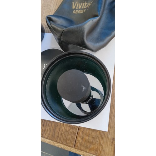 16 - Vivitar Series 1 500mm mirror lens plus Nikon lens series E 50mm 1:1.8 lens
