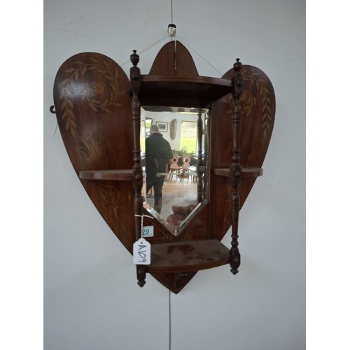 29 - Victorian heart shaped wooden with inlaid design wall mirror with shelves 54cm x 63cm approx. As fou... 