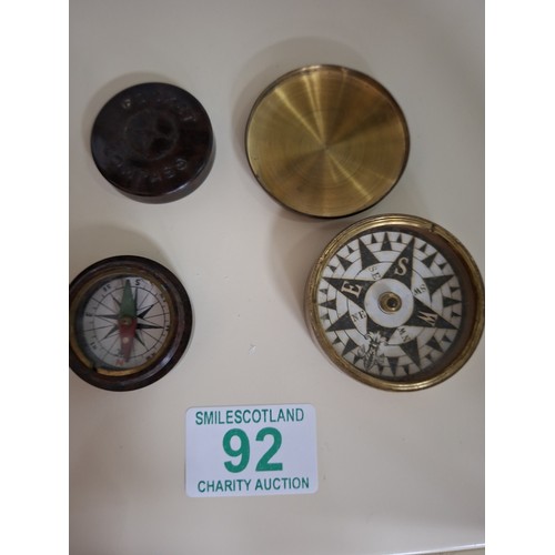92 - 1 Bakelite and 1 metal pocket compass