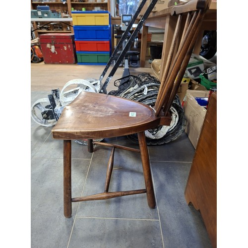 Vintage triangular style chair with unusual back
