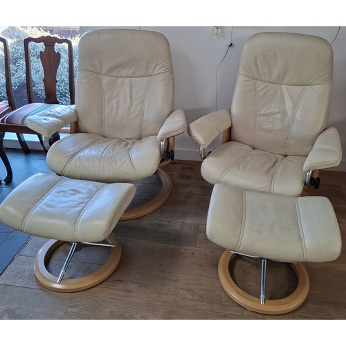 7 - Pair of Ekornes stressless cream leather reclining chairs and footstools