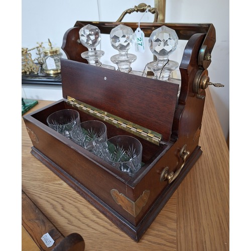27 - Antique tantalus with decanters and the unusual 3 glass drawer set