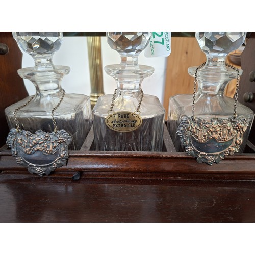 27 - Antique tantalus with decanters and the unusual 3 glass drawer set