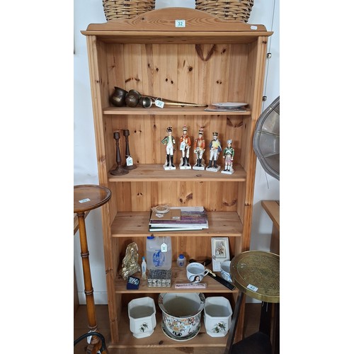 32 - Pine bookcase 170cm x 77cm approx. This item is to be sold at the hammer price plus 20% VAT and 20% ... 