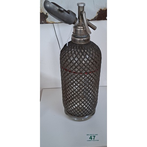 47 - Vintage sparklets Limited London soda stream wire net bottle