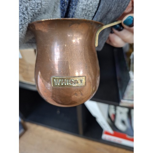 190 - Brass large candle holder, brass boots and copper spirit ladles