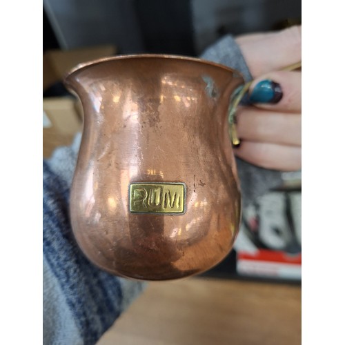 190 - Brass large candle holder, brass boots and copper spirit ladles