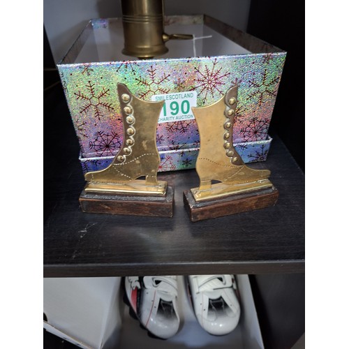 190 - Brass large candle holder, brass boots and copper spirit ladles